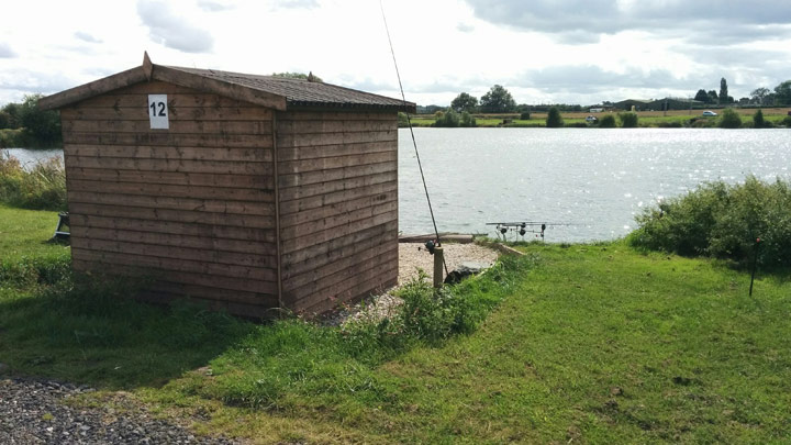 Quarry carp fishing hut side view